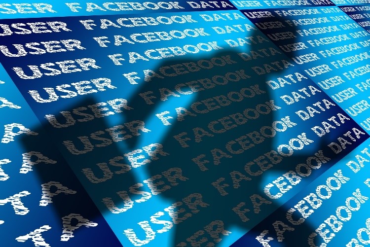 Shadow man with briefcase running from Facebook background with user data